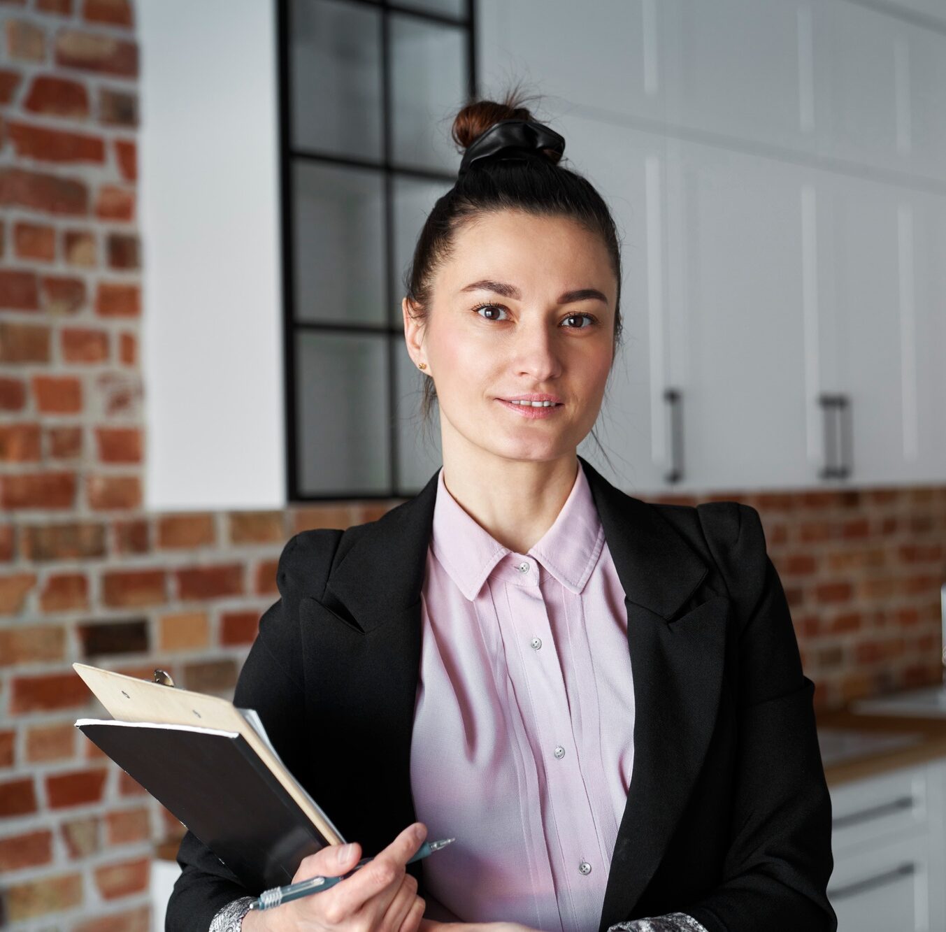 Close up of portrait of real estate agent in new apartment